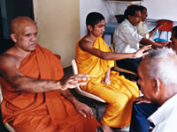 A priest practicing Johrei