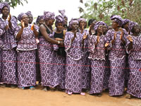 African members celebrate the completion wearing matching folk costume.